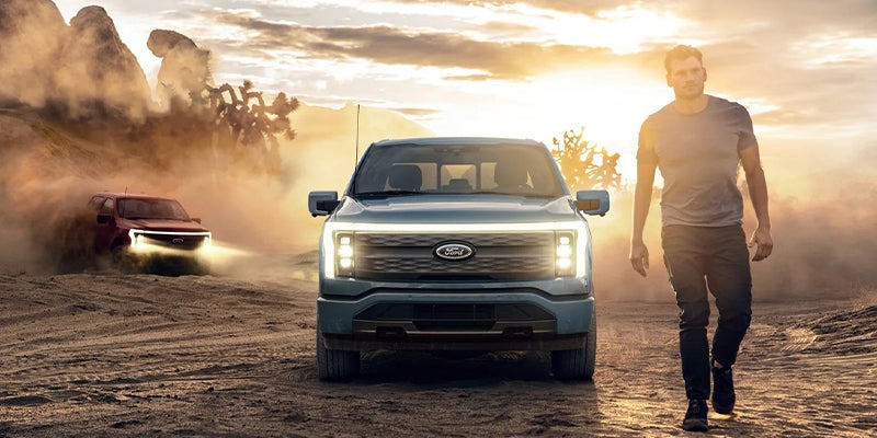 Gray Ford F-150 Lightning running offroad